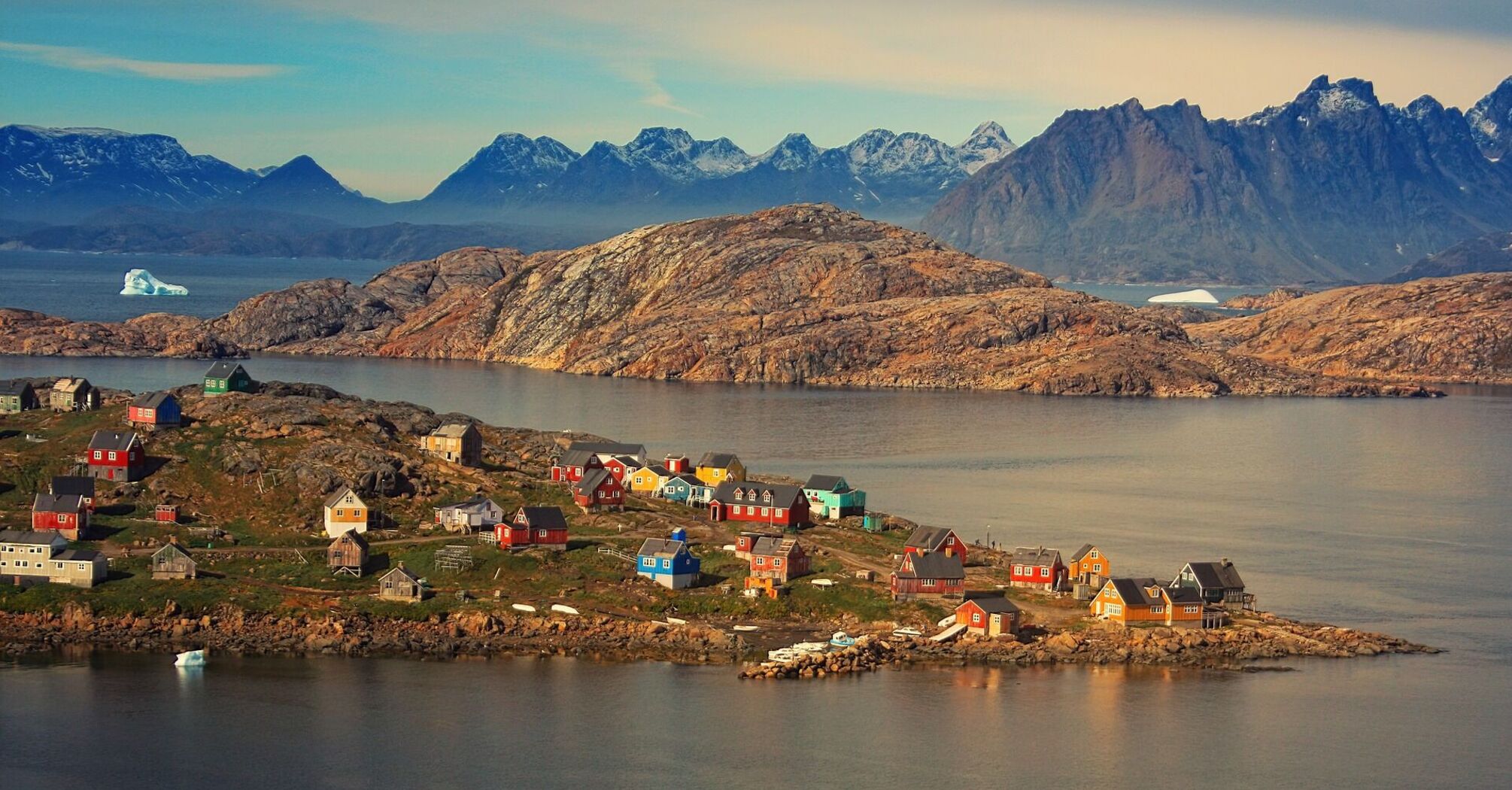 Scenic Greenland village with colorful houses and mountainous backdrop