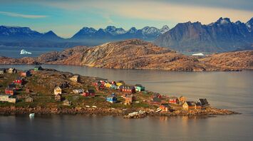 Scenic Greenland village with colorful houses and mountainous backdrop