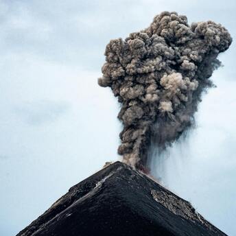 Volcanic ash cloud rising from an eruption