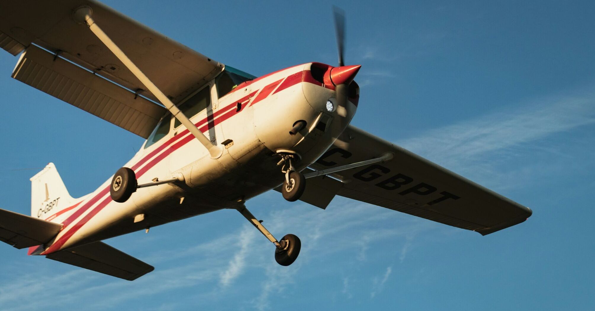 Small aircraft in flight with clear skies