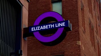 Elizabeth Line station sign on a brick building in London