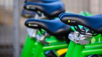 Close-up of Lime bike seats lined up