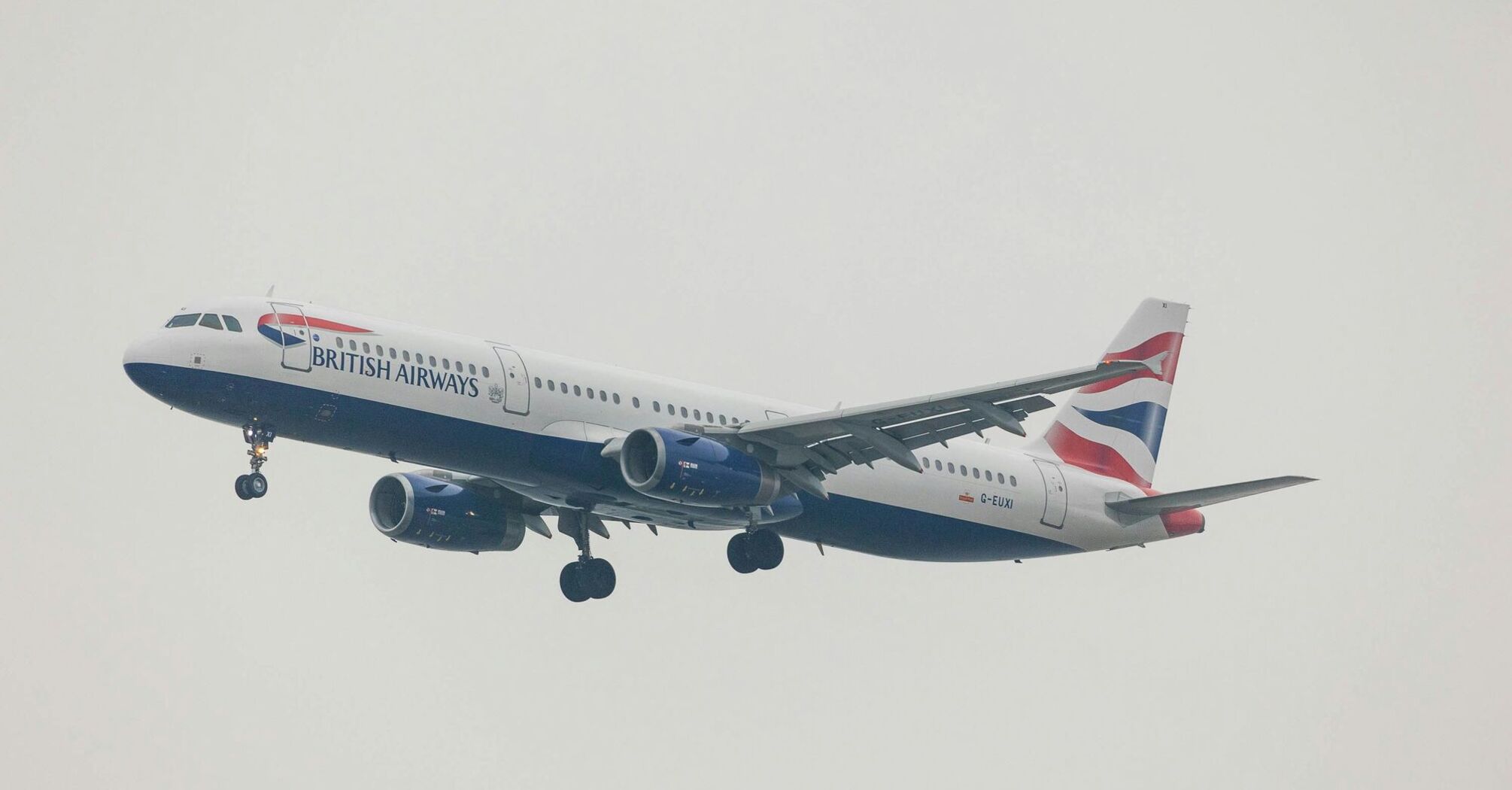 Airliner of an English company landing with cart extracted.