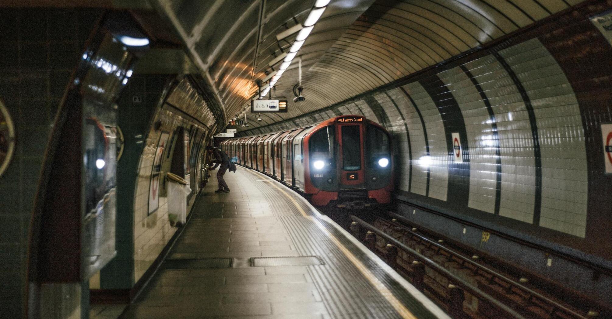 London Underground train arriving at a station platform