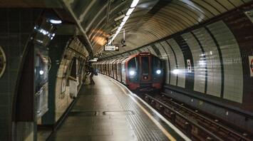 London Underground train arriving at a station platform