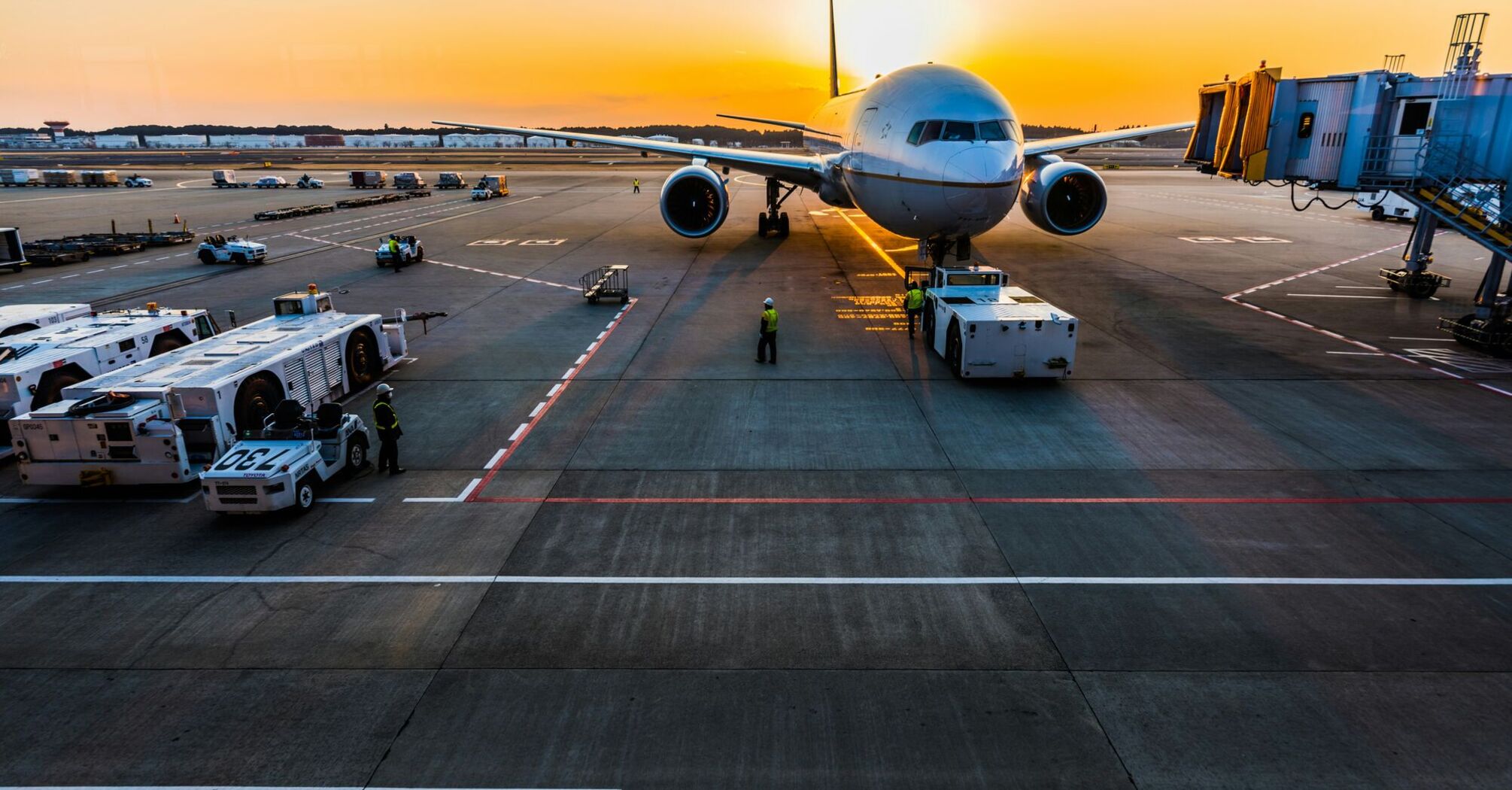 gray airplane on parking