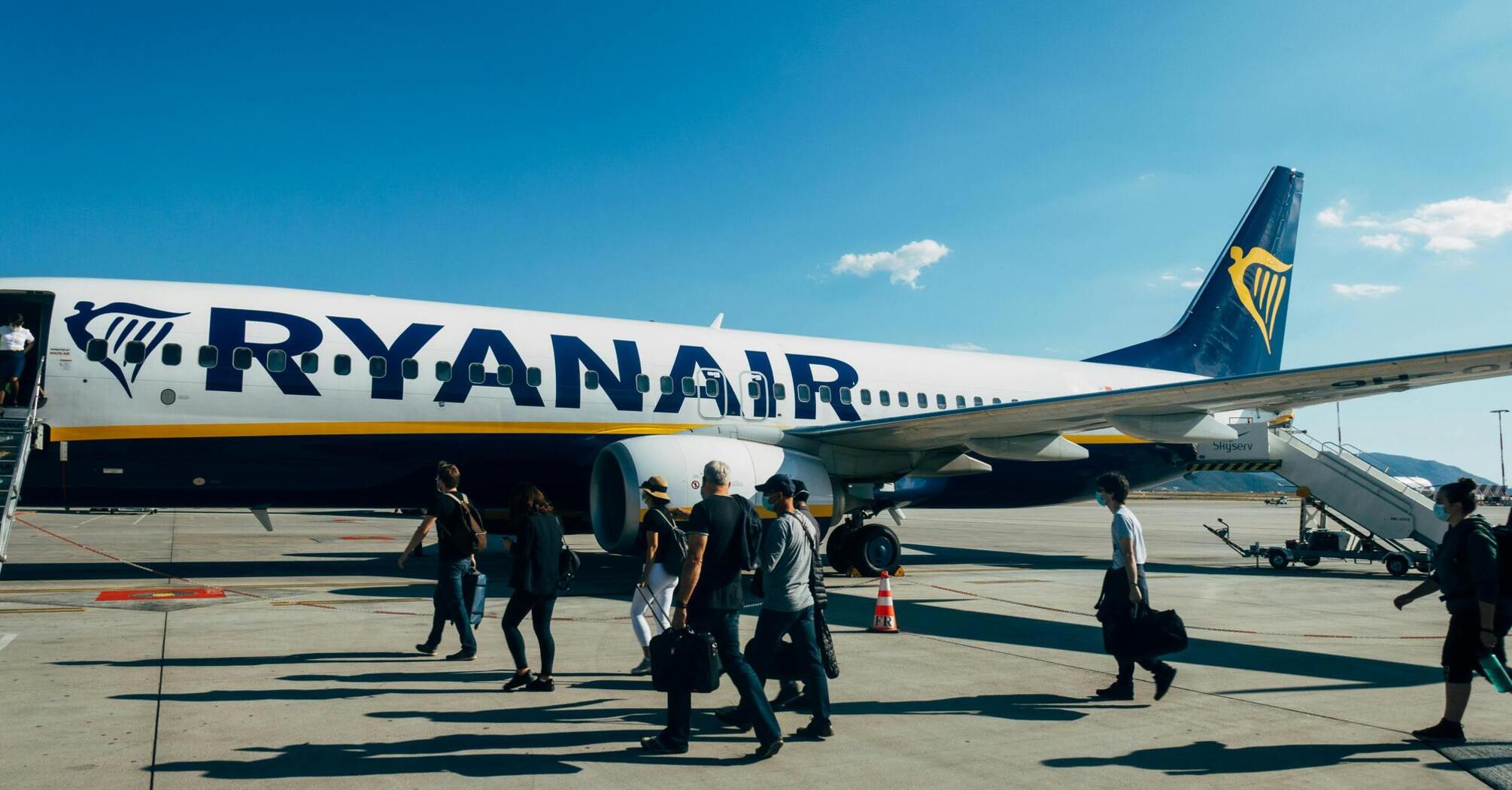 Passengers boarding a Ryanair airplane at the airport