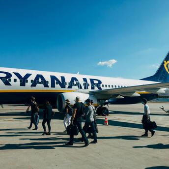 Passengers boarding a Ryanair airplane at the airport