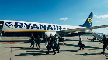 Passengers boarding a Ryanair airplane at the airport