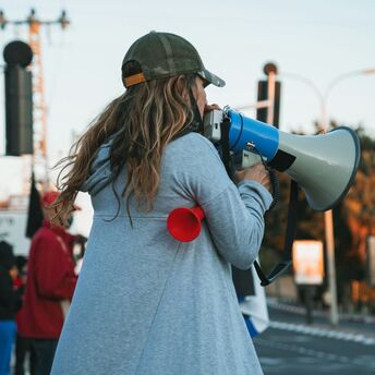 A protester using a megaphone during a demonstration