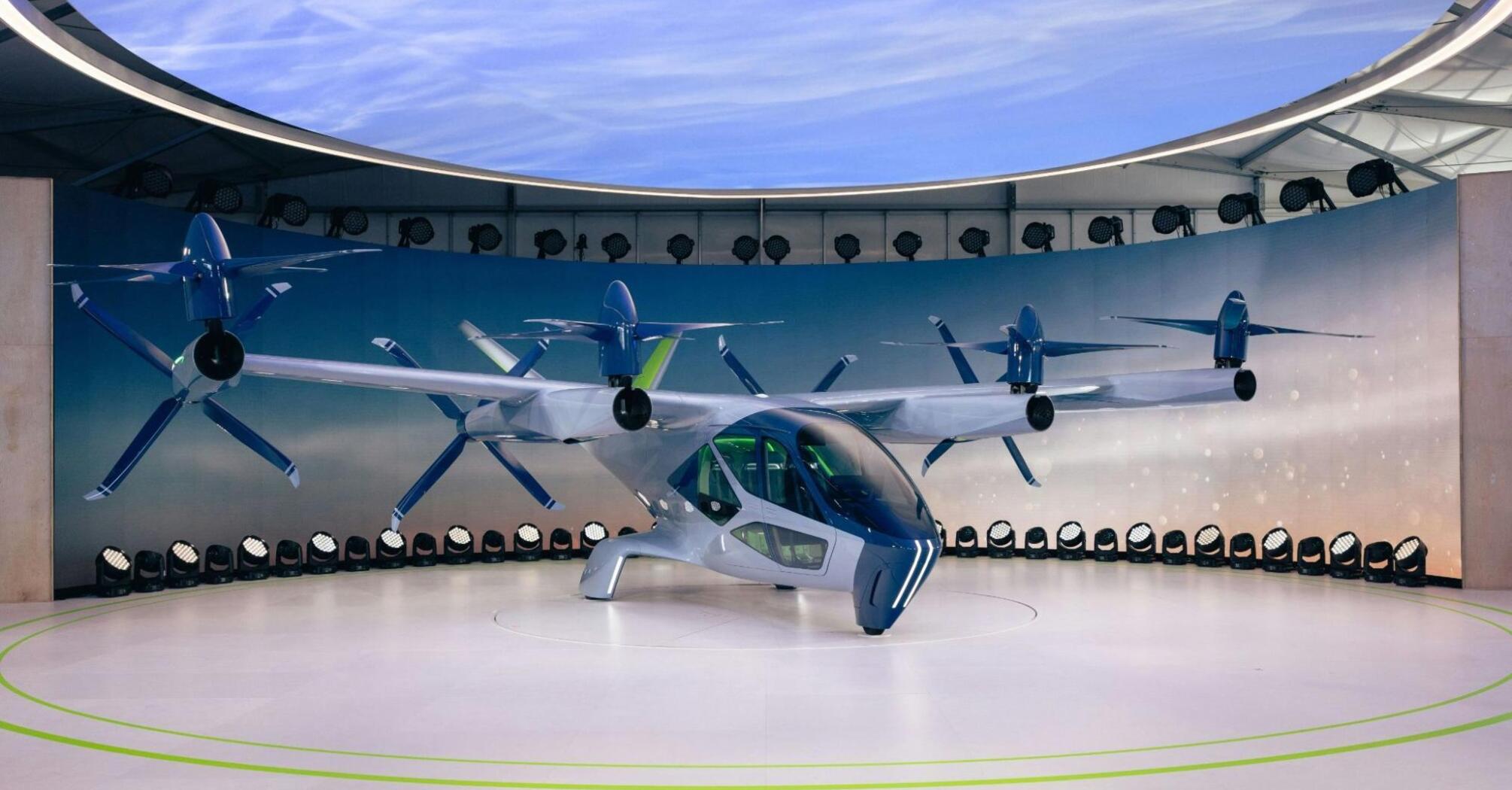 A futuristic electric flying taxi on display