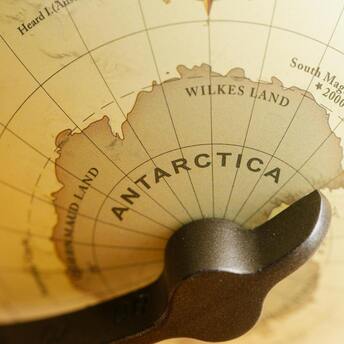 Close-up of Antarctica on a globe