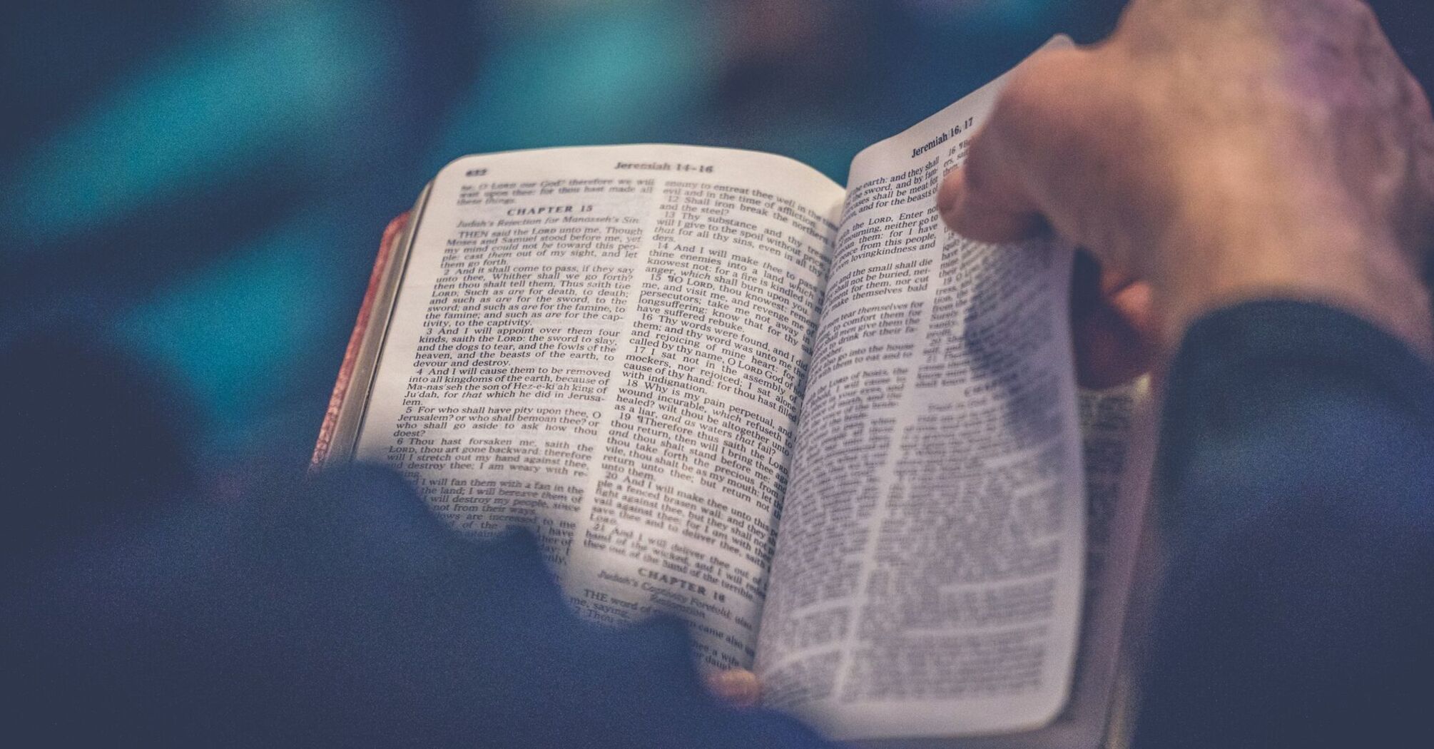 A person reading an open Bible