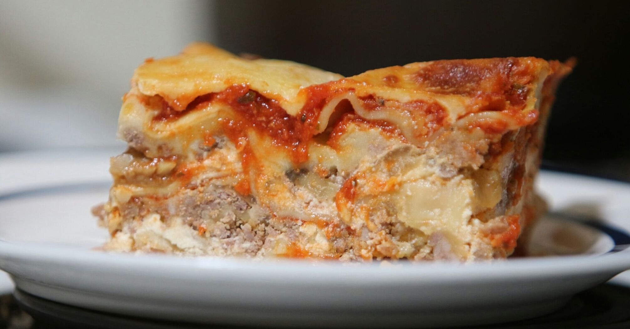 Close-up of a slice of lasagne on a plate