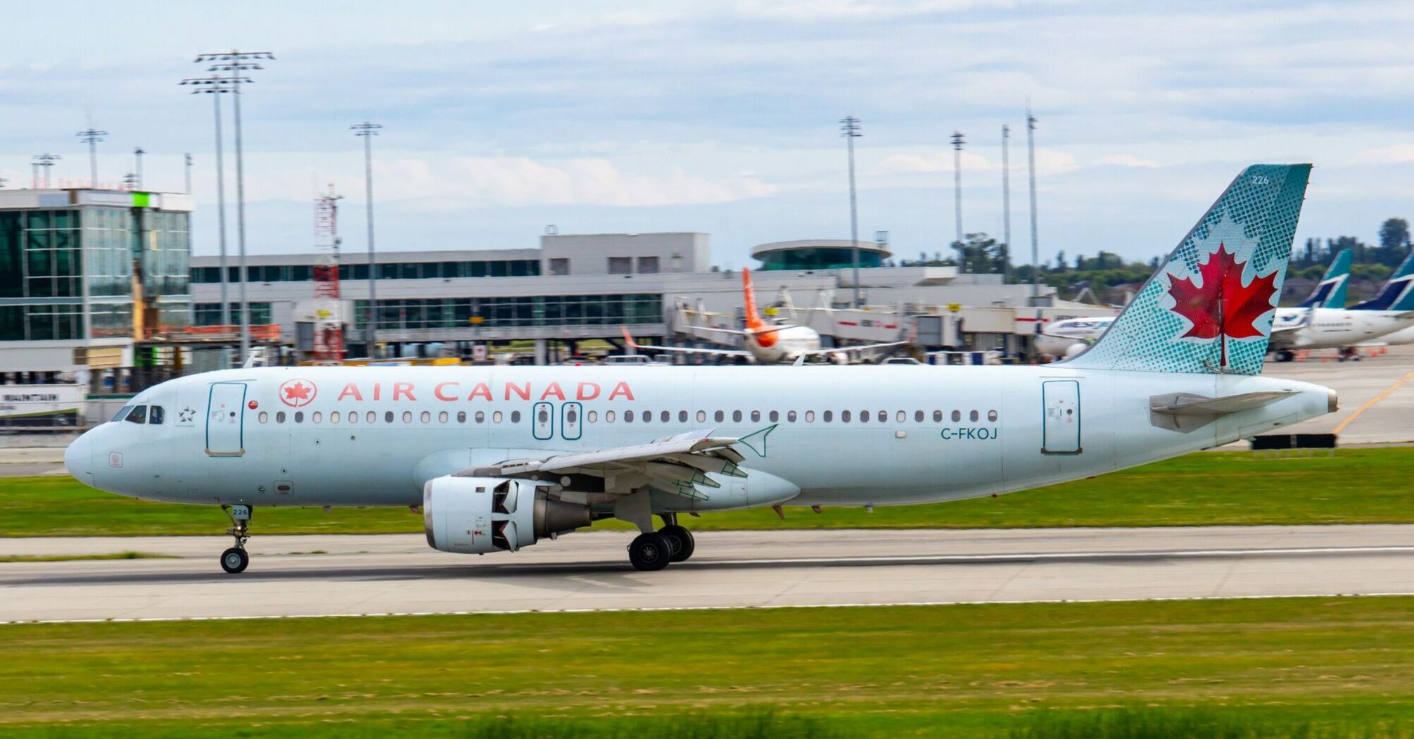 Air Canada airplane on the runway at an airport