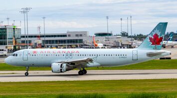 Air Canada airplane on the runway at an airport