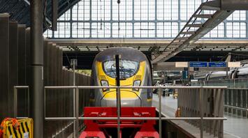 A Eurostar train at a station platform, ready for departure