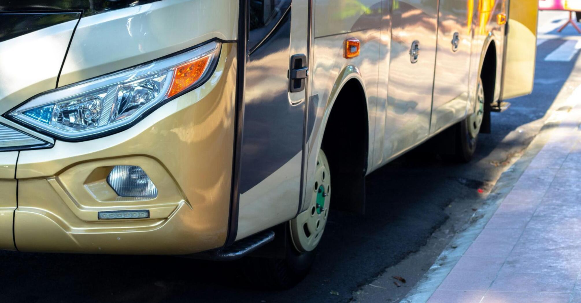 Front view of a modern First Bus coach ready for travel