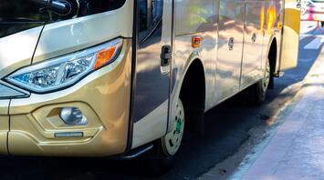 Front view of a modern First Bus coach ready for travel