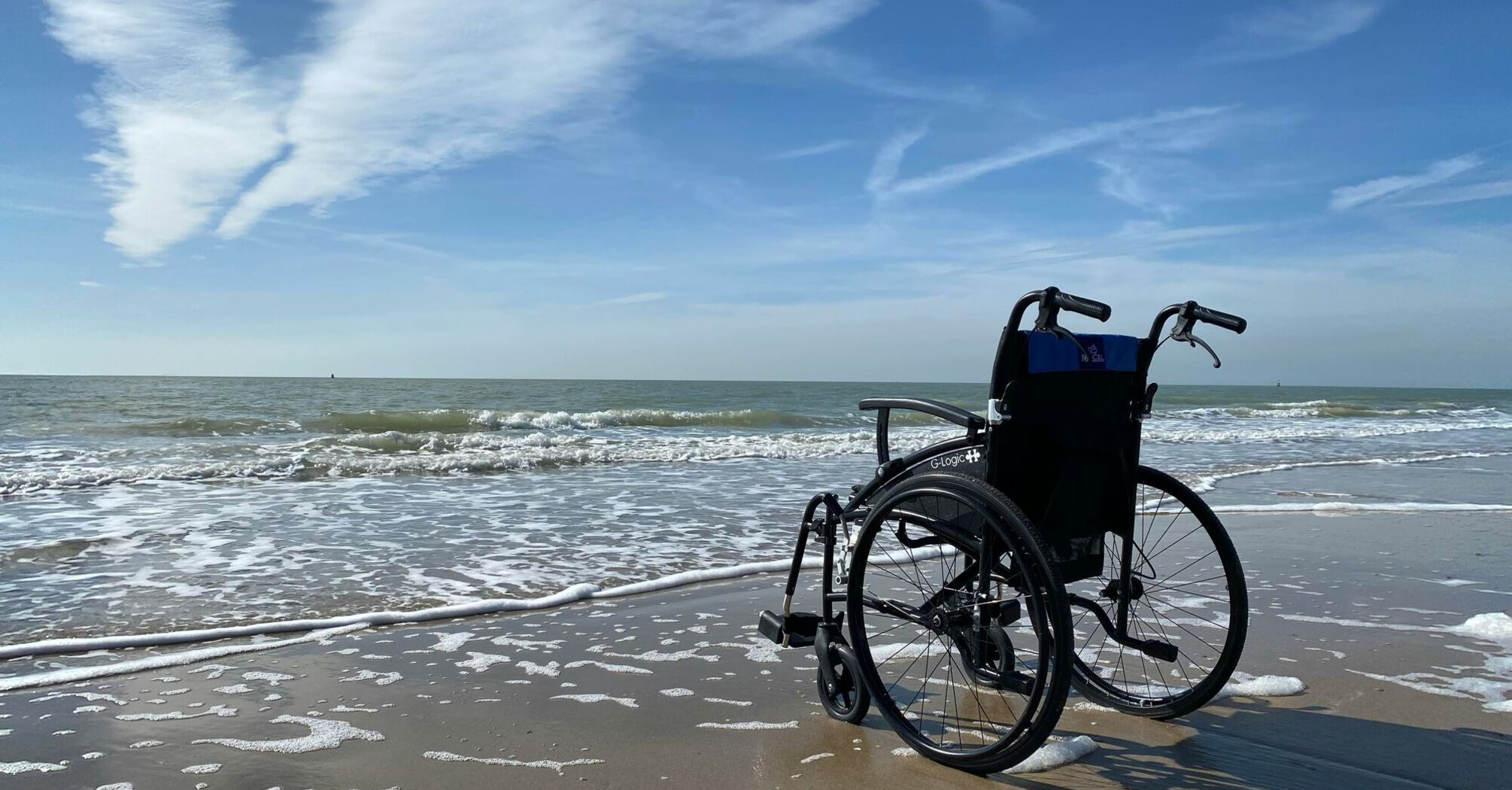 black and gray wheelchair on beach during daytime