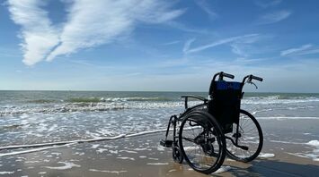 black and gray wheelchair on beach during daytime