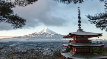 Snowcapped Mount Fuji with a traditional pagoda in foreground