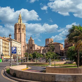 Historic buildings and palm trees in Valencia, Spain