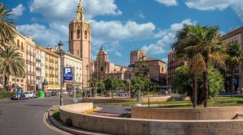 Historic buildings and palm trees in Valencia, Spain