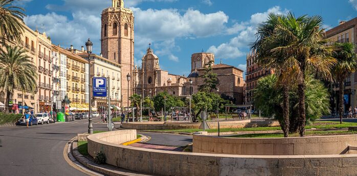 Historic buildings and palm trees in Valencia, Spain