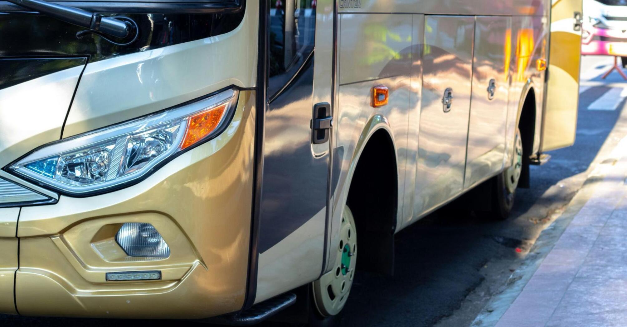 A modern eco-friendly bus parked on a street, highlighting sustainable public transport solutions