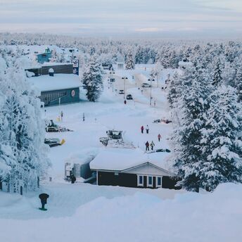 A snowy Lapland village with tourists