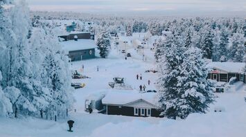 A snowy Lapland village with tourists