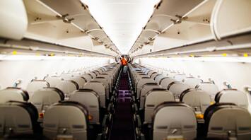 Empty airplane cabin with rows of seats