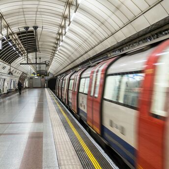 A London Underground train at a station platform