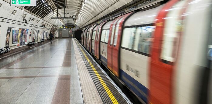 A London Underground train at a station platform