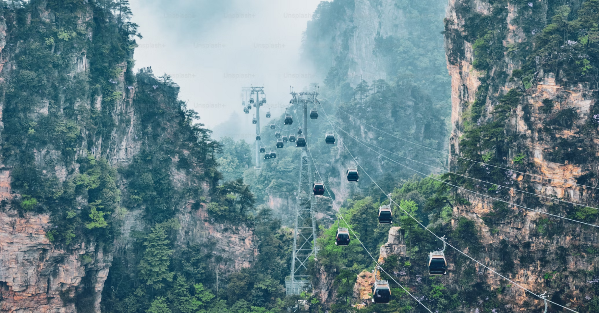 Cable cars amidst towering cliffs in Zhangjiajie