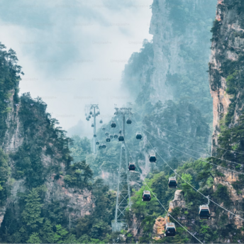 Cable cars amidst towering cliffs in Zhangjiajie