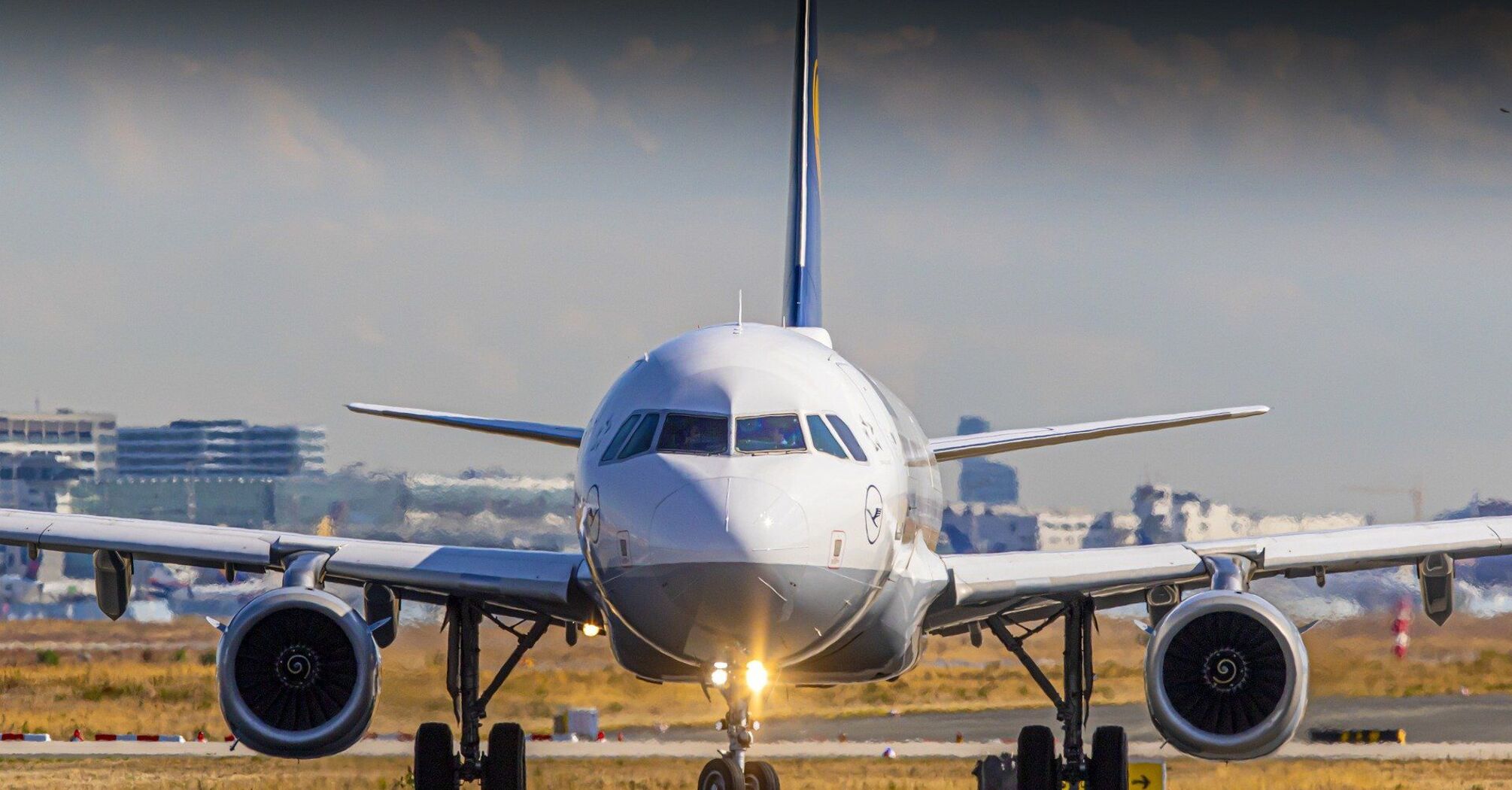 A passenger airplane on a runway at an airport