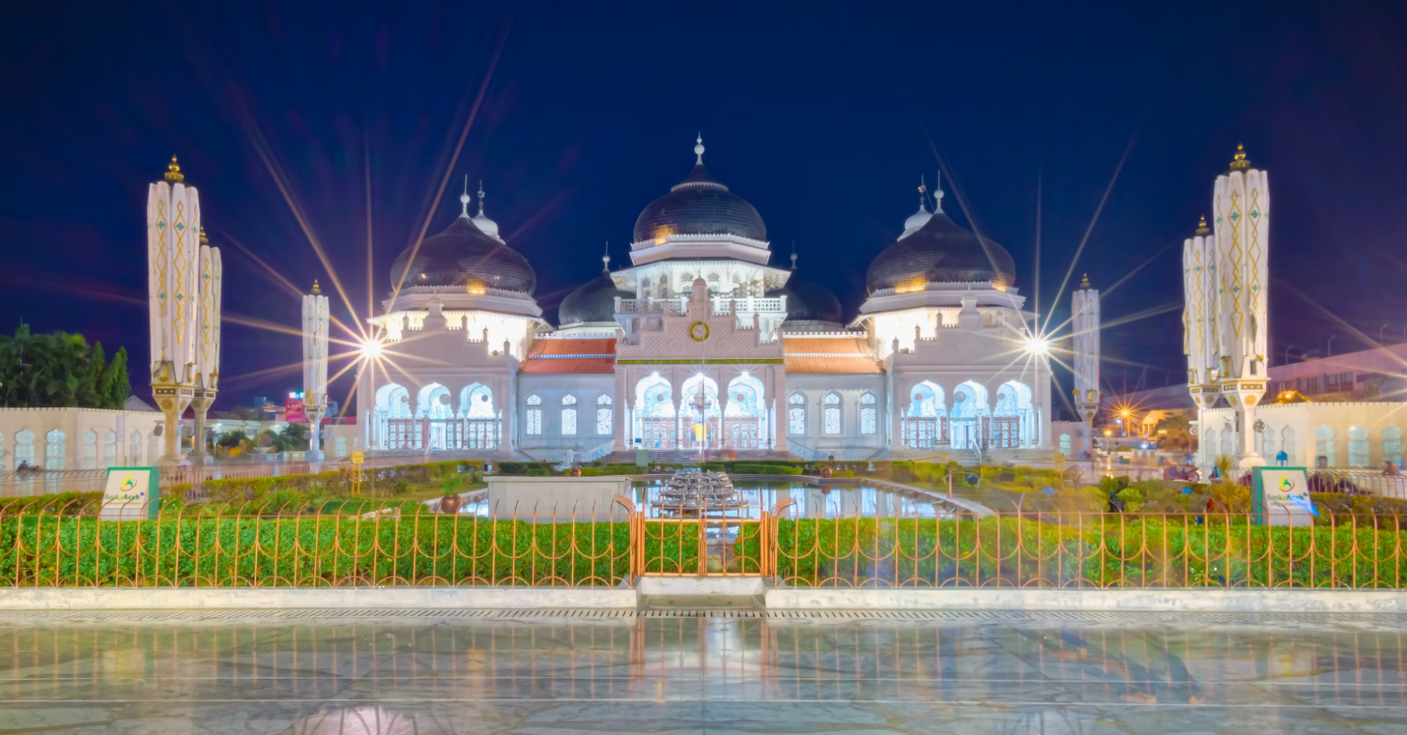 Baiturrahman Grand Mosque illuminated at night in Banda Aceh