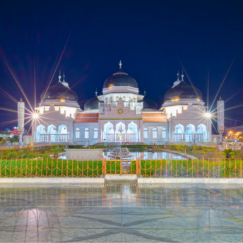 Baiturrahman Grand Mosque illuminated at night in Banda Aceh