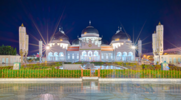 Baiturrahman Grand Mosque illuminated at night in Banda Aceh