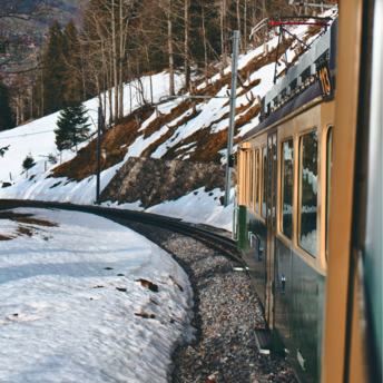 Panoramic view from a train in snowy Swiss Alps