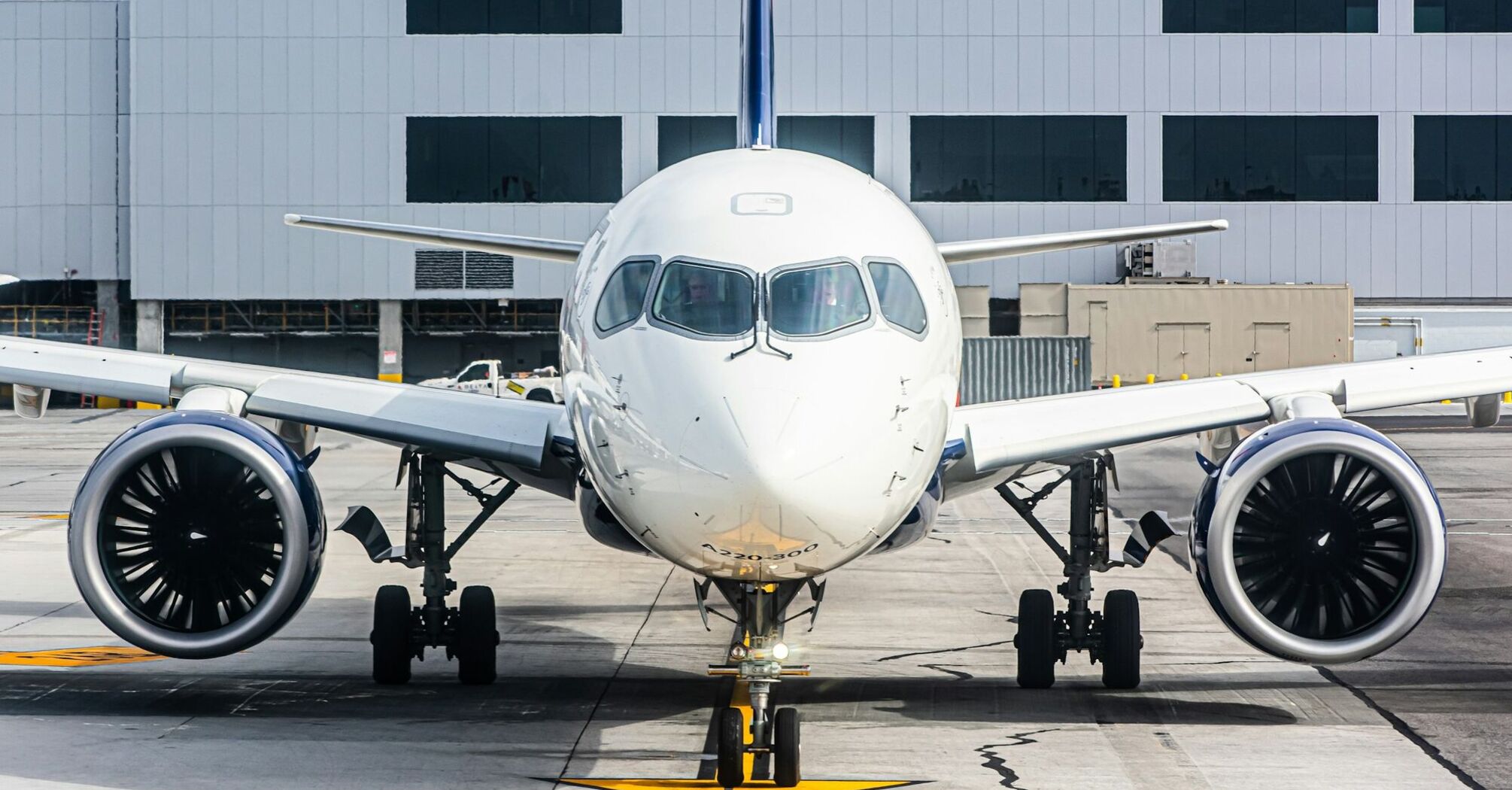 Front view of a Delta aircraft at the airport