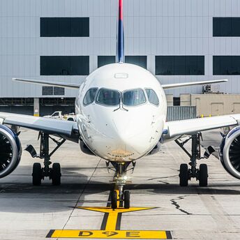 Front view of a Delta aircraft at the airport