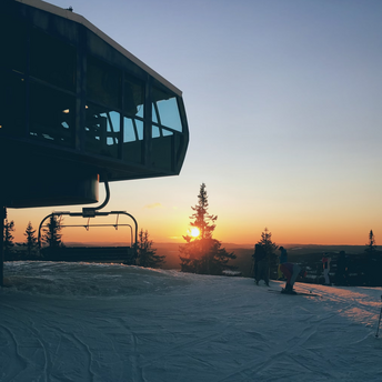 Sunset view from a snowy ski lift station in Scandinavia