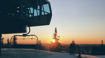 Sunset view from a snowy ski lift station in Scandinavia