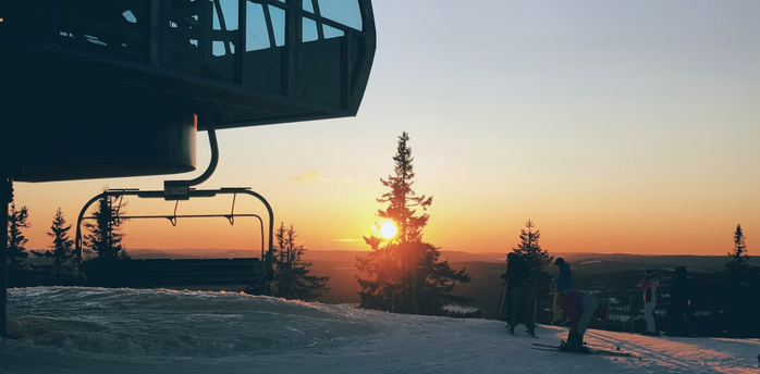 Sunset view from a snowy ski lift station in Scandinavia