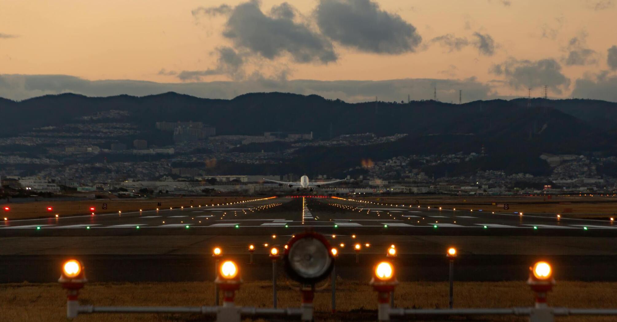 Airplane taking off or landing at dusk