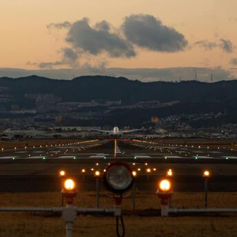 Airplane taking off or landing at dusk