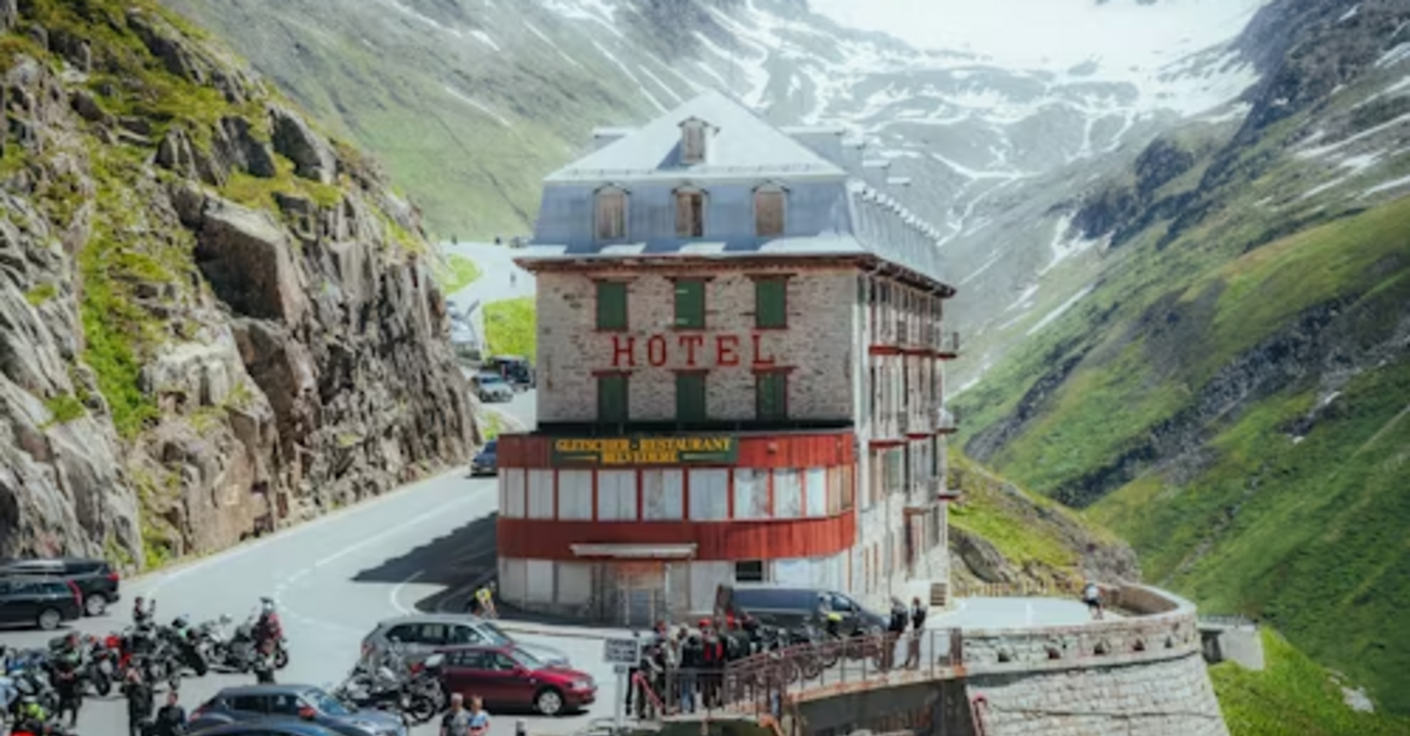 A historic hotel perched on a winding mountain road